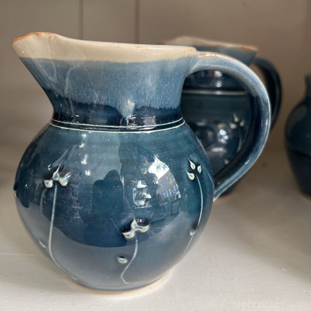 Pitcher, blue flowers