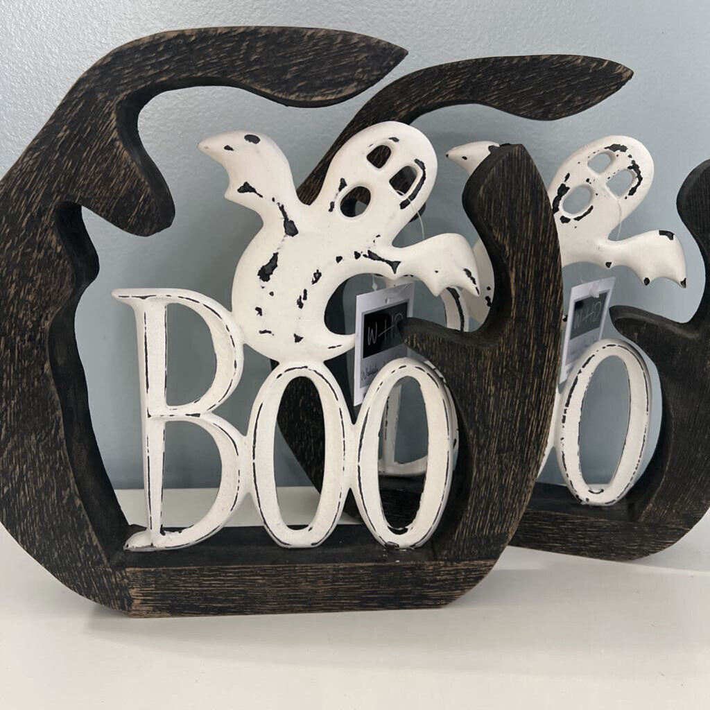 White metal ghost boo with black wood around