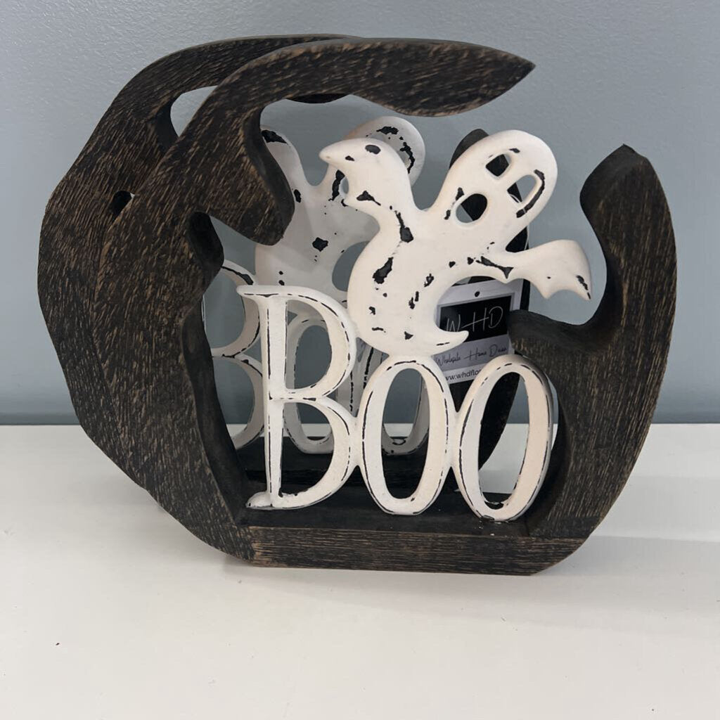 White metal ghost boo with black wood around